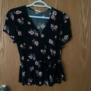 Size small black and floral v neck blouse with tie wrap in side